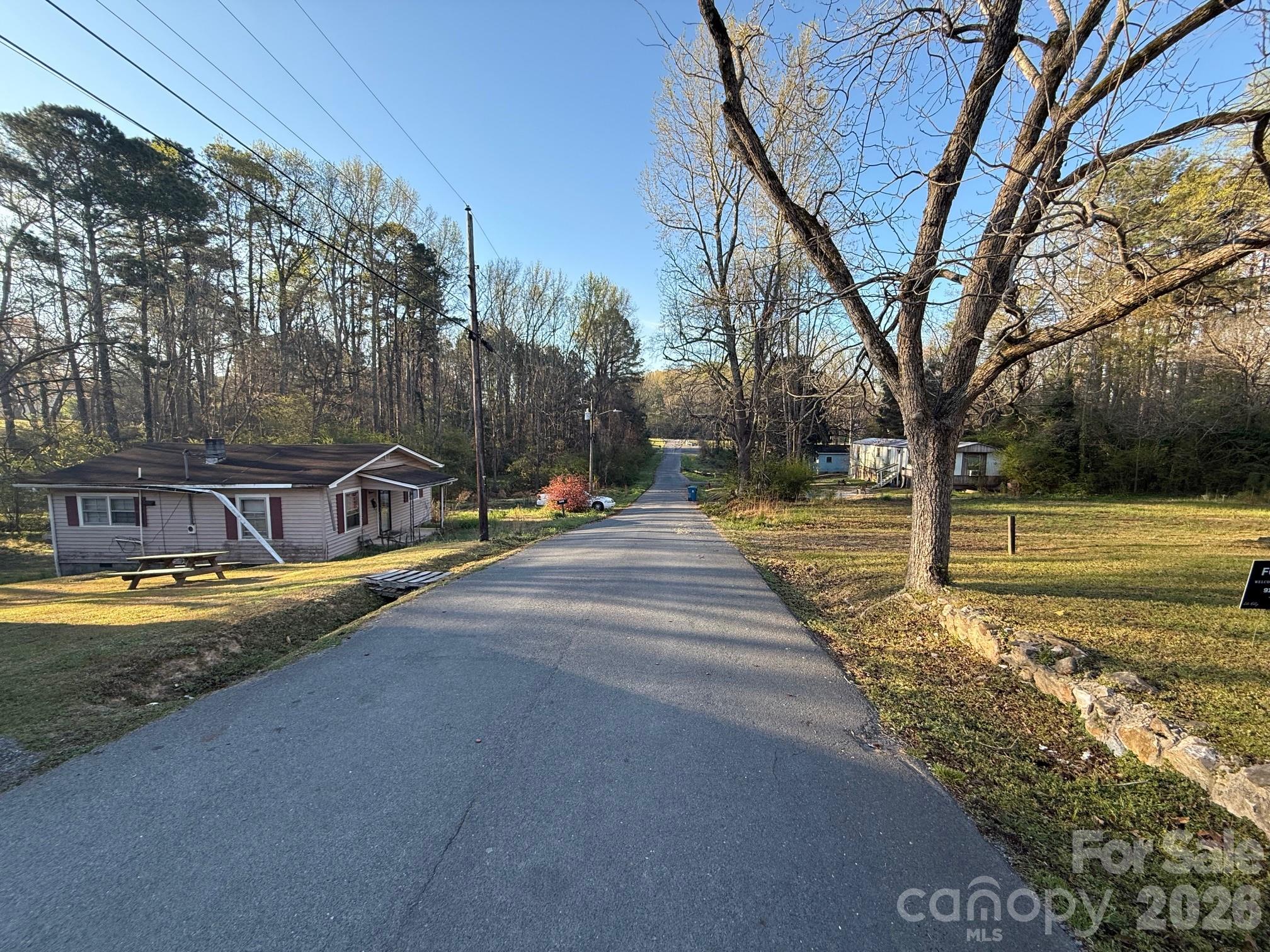 624 Blue Street Troy, NC 27371 - Photo 10 of 14 a view of a swimming pool with a bench in the patio