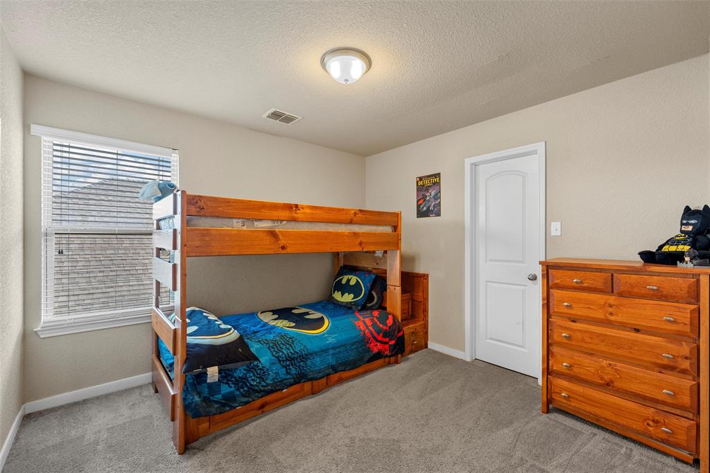 10620 Langham Drive Waco, TX 76708 - Photo 14 of 30 a bedroom with a bed and a window