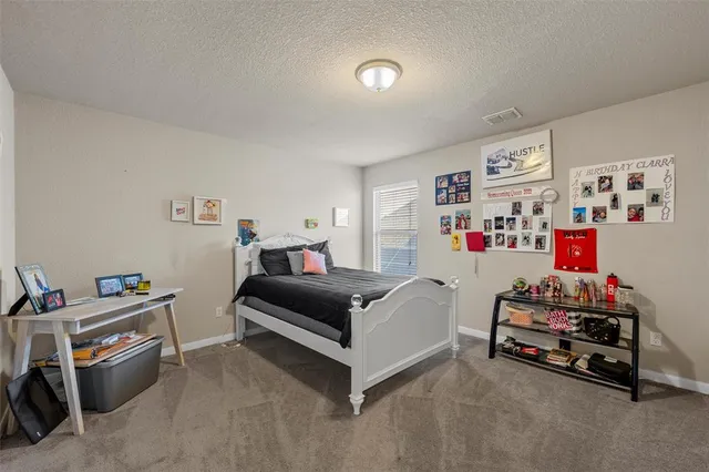 a bedroom with furniture and a bed