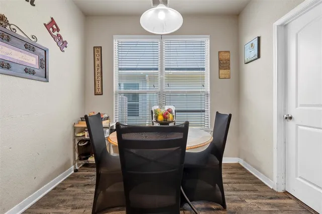 a view of a dining room with furniture and window