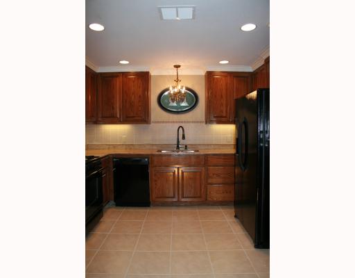 633 Chamberlain Street Corpus Christi, TX 78404 - Photo 4 of 9 a kitchen with a sink and a stove