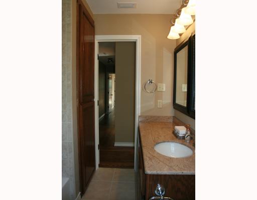 633 Chamberlain Street Corpus Christi, TX 78404 - Photo 9 of 9 a bathroom with a sink and a mirror
