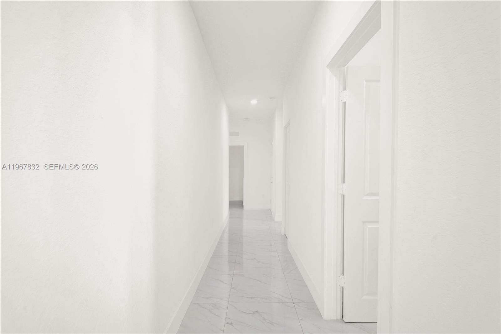 19059 Southwest 134th Court Miami, FL 33177 - Photo 16 of 52 a view of a hallway