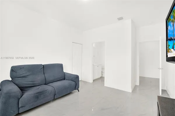 a living room with furniture and a couch