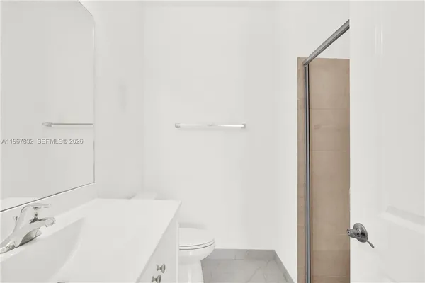 a bathroom with a sink toilet and vanity