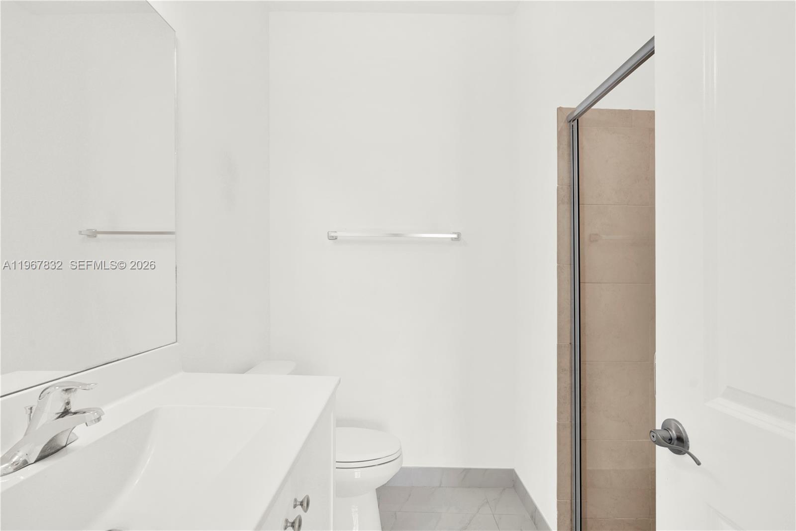 19059 Southwest 134th Court Miami, FL 33177 - Photo 20 of 52 a bathroom with a sink toilet and vanity