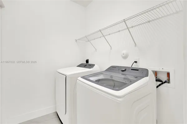 a utility room with dryer and washer