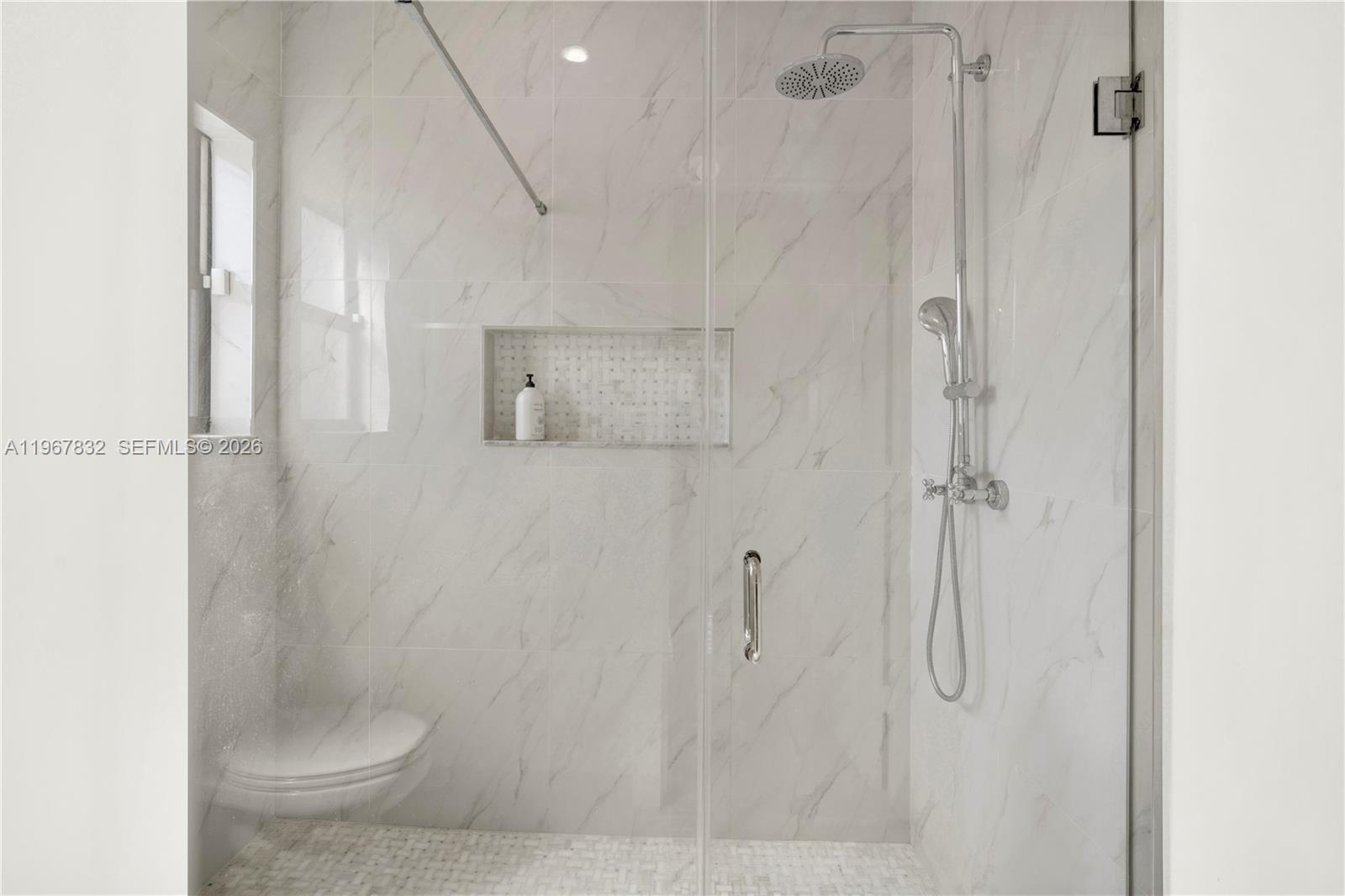 19059 Southwest 134th Court Miami, FL 33177 - Photo 27 of 52 a bathroom with a shower