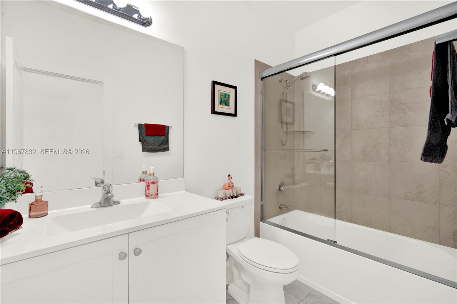 19059 Southwest 134th Court Miami, FL 33177 - Photo 31 of 52 a bathroom with a sink toilet and shower