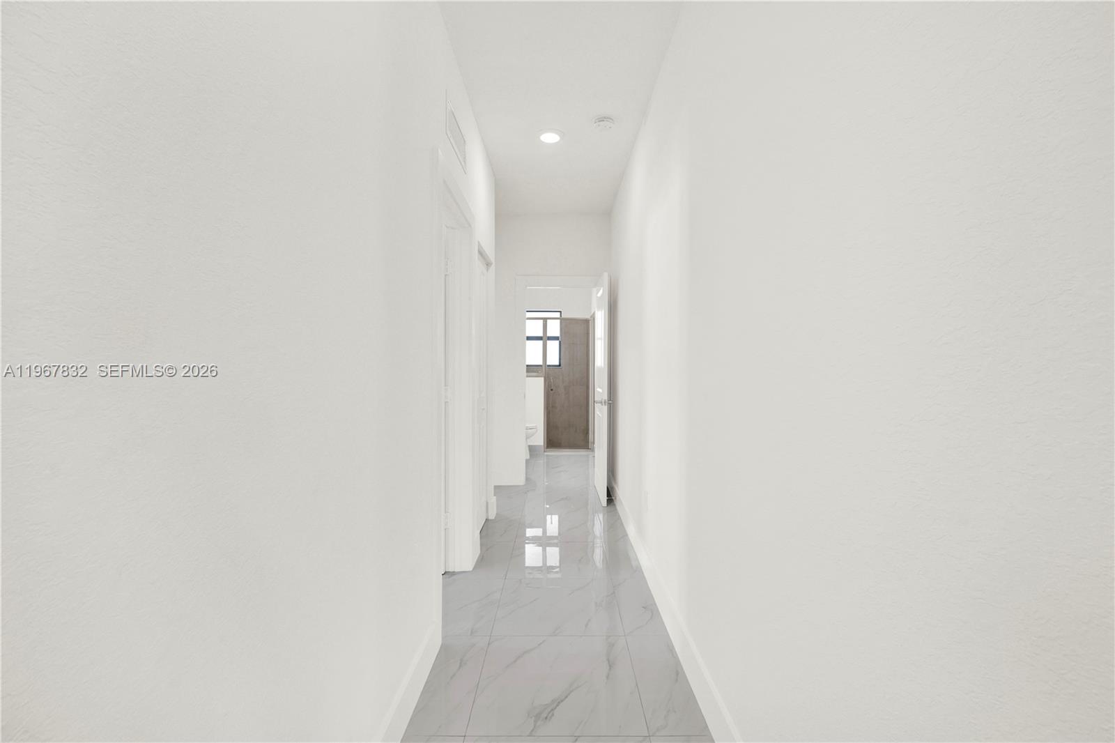 19059 Southwest 134th Court Miami, FL 33177 - Photo 32 of 52 a view of a hallway with wooden floor