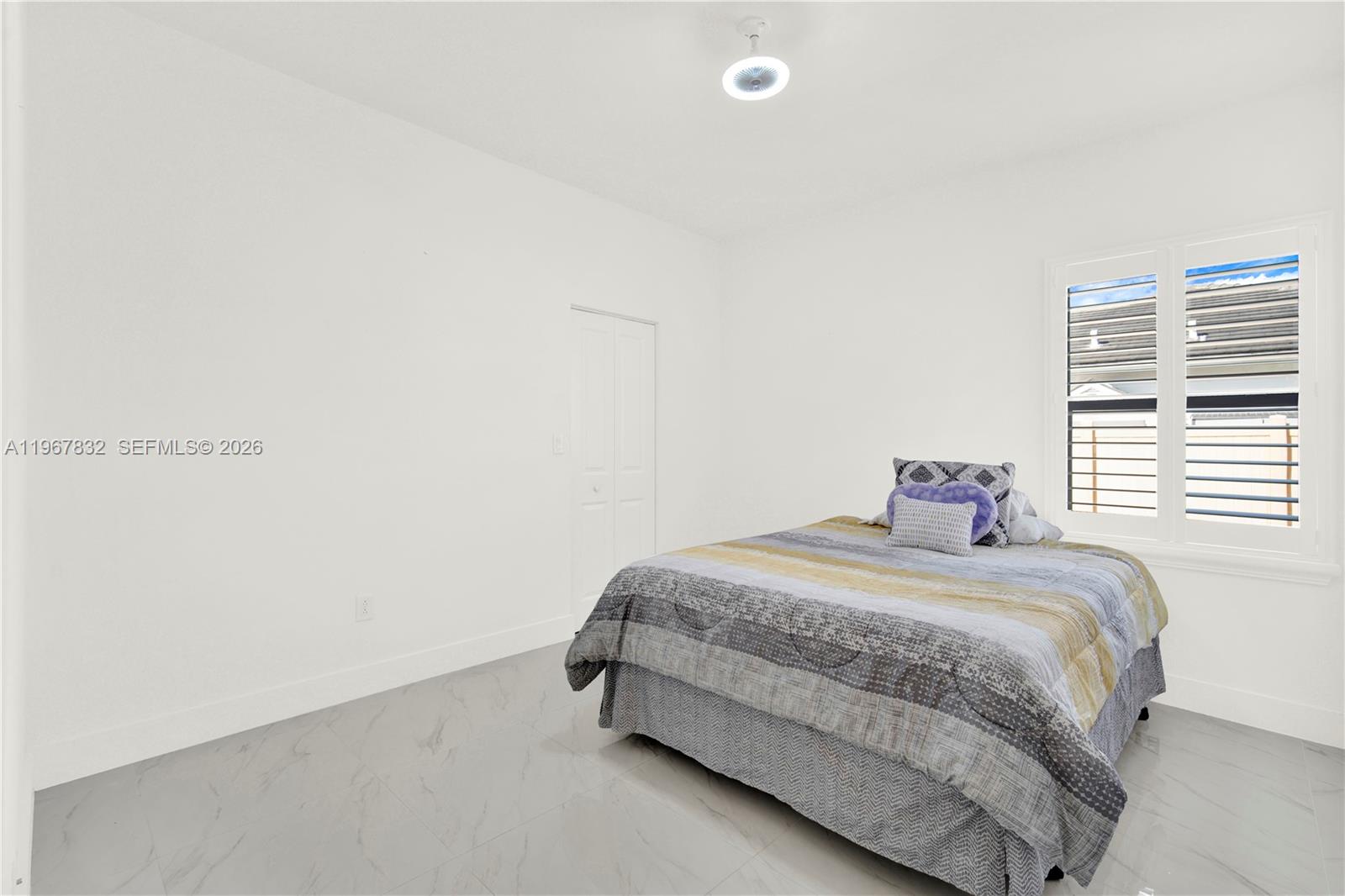 19059 Southwest 134th Court Miami, FL 33177 - Photo 33 of 52 a bedroom with a bed and a window