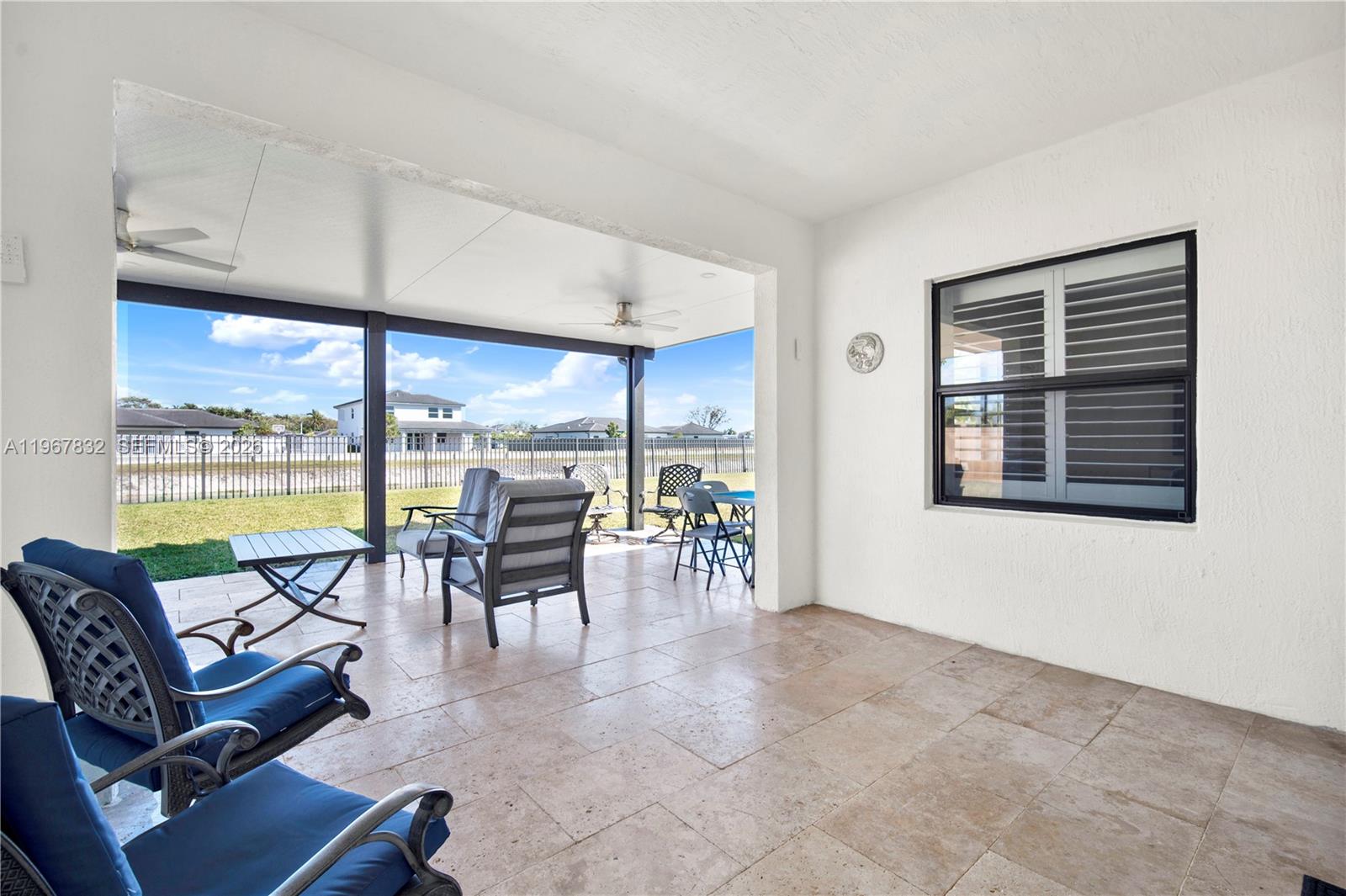 19059 Southwest 134th Court Miami, FL 33177 - Photo 36 of 52 a living room with furniture and large windows