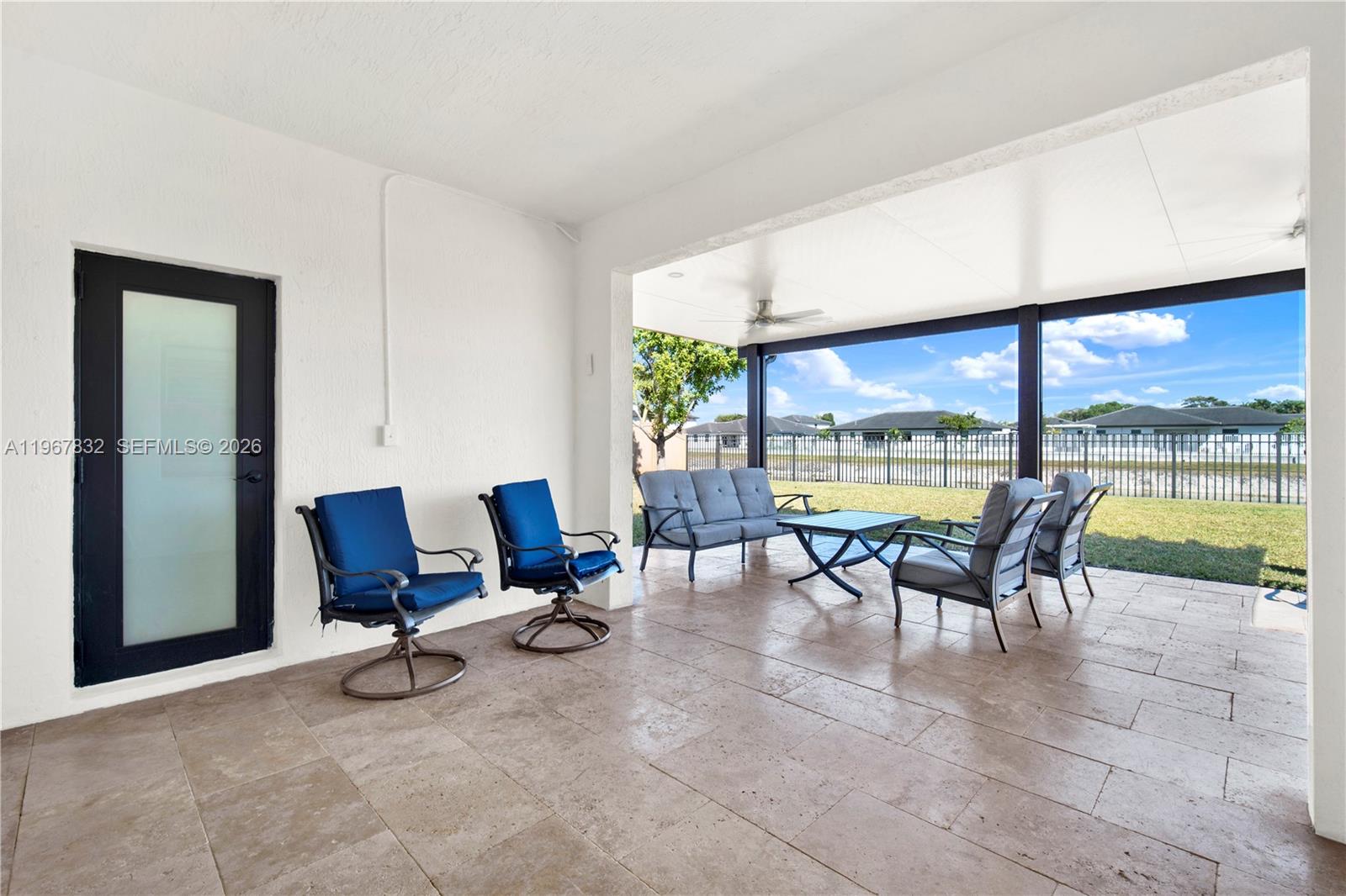 19059 Southwest 134th Court Miami, FL 33177 - Photo 37 of 52 a view of a work space with furniture and floor to ceiling window