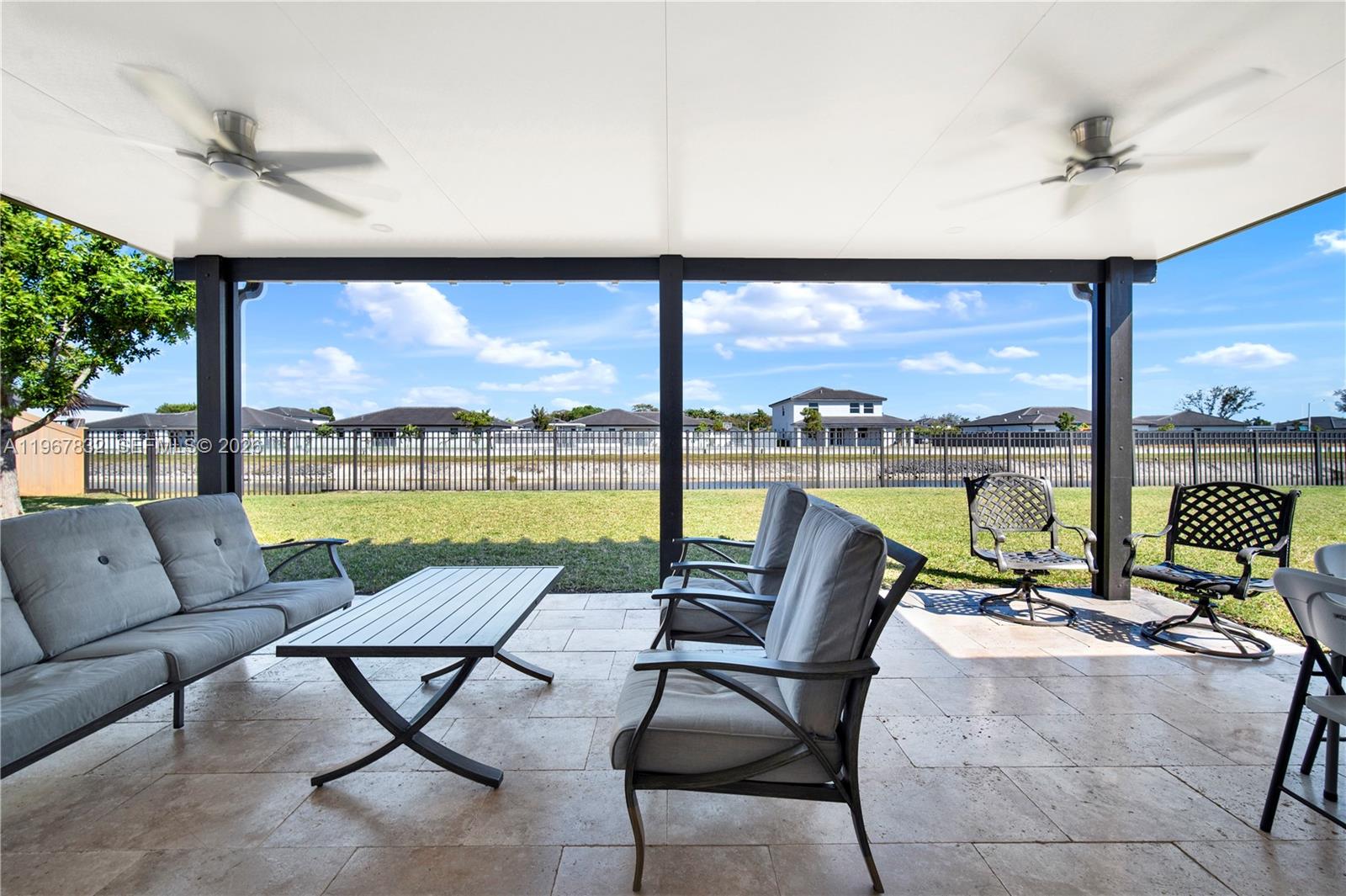 19059 Southwest 134th Court Miami, FL 33177 - Photo 38 of 52 a living room with furniture and a large window