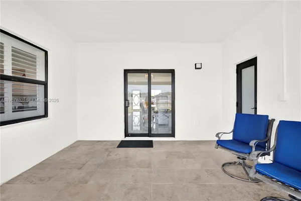 a view of livingroom with furniture and lounge chair