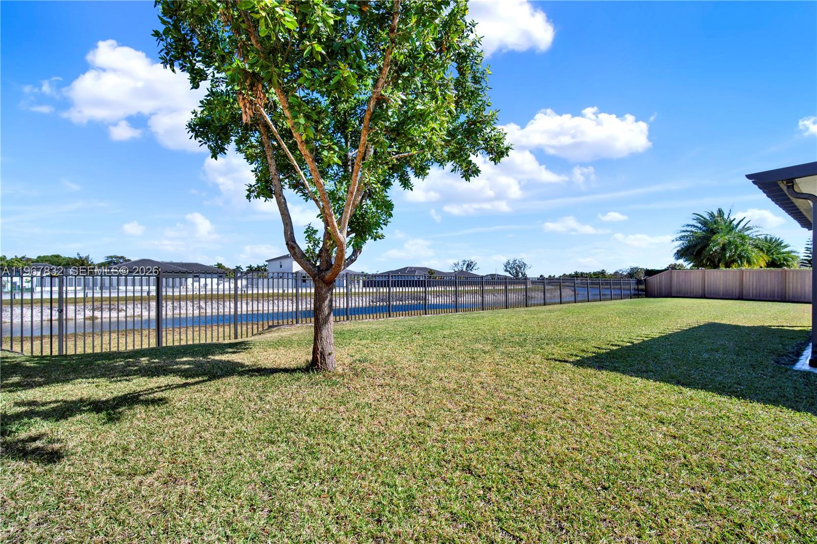 19059 Southwest 134th Court Miami, FL 33177 - Photo 41 of 52 a view of a garden with a tree