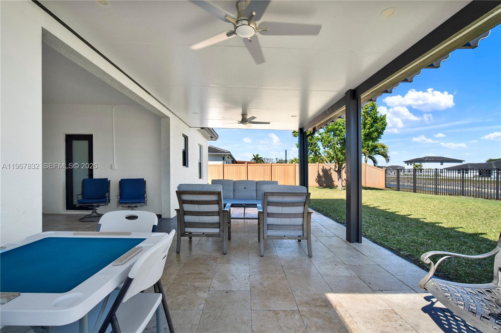 19059 Southwest 134th Court Miami, FL 33177 - Photo 45 of 52 a dining room with furniture and a garden