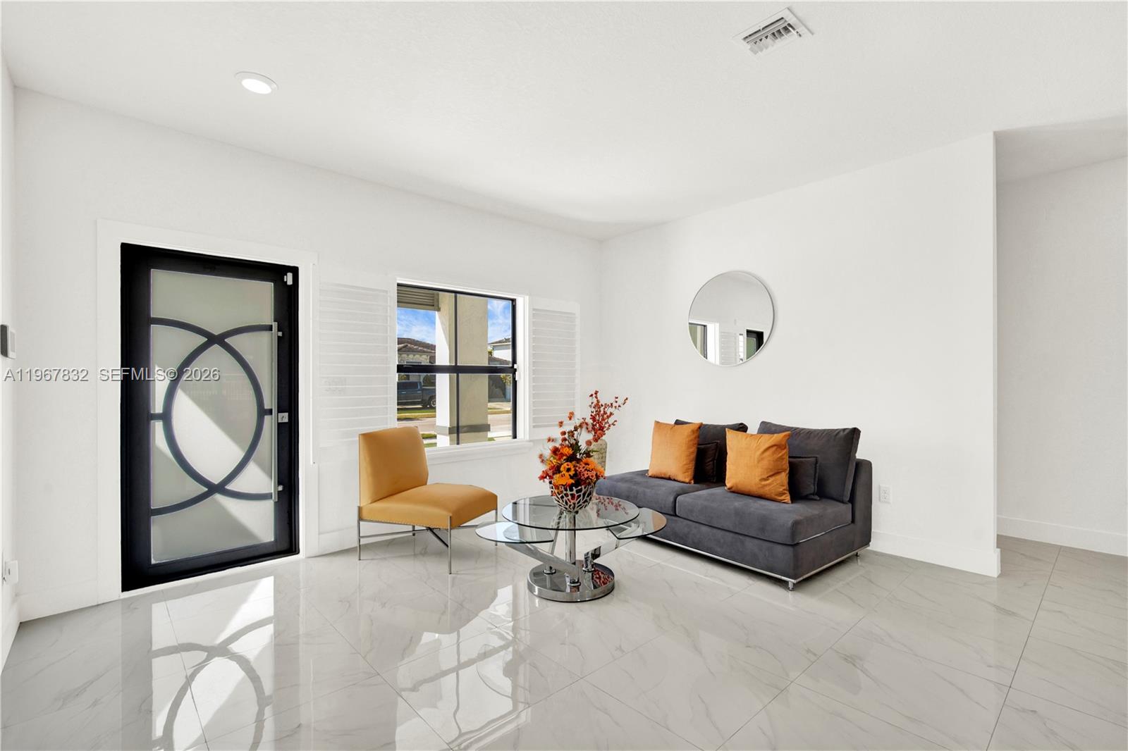 19059 Southwest 134th Court Miami, FL 33177 - Photo 5 of 52 a living room with furniture and a potted plant