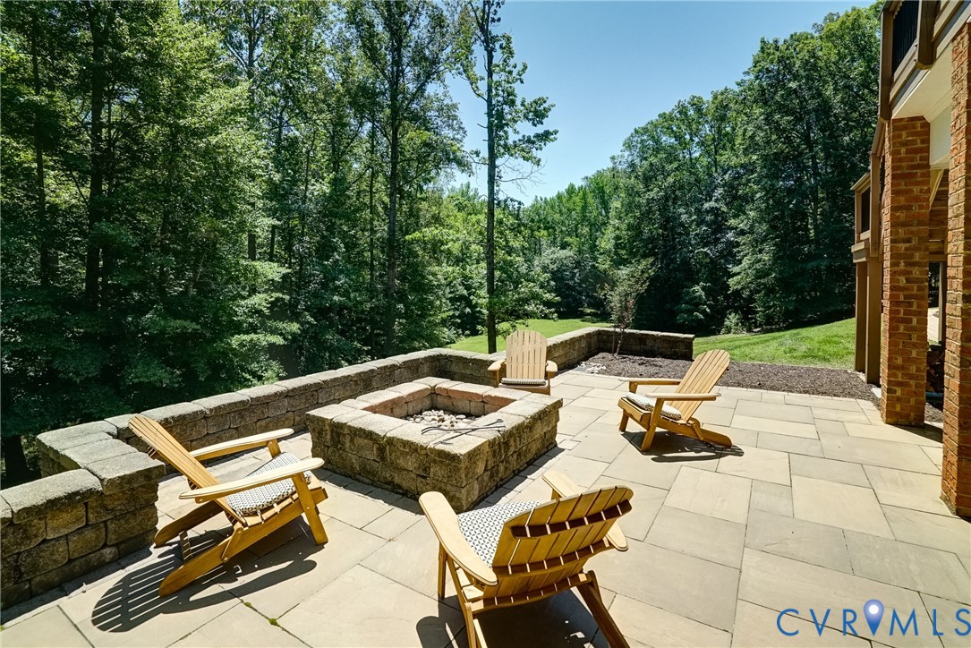 1295 Hermitage Road Manakin-Sabot, VA 23103 - Photo 11 of 55 a view of a patio with chairs and a table