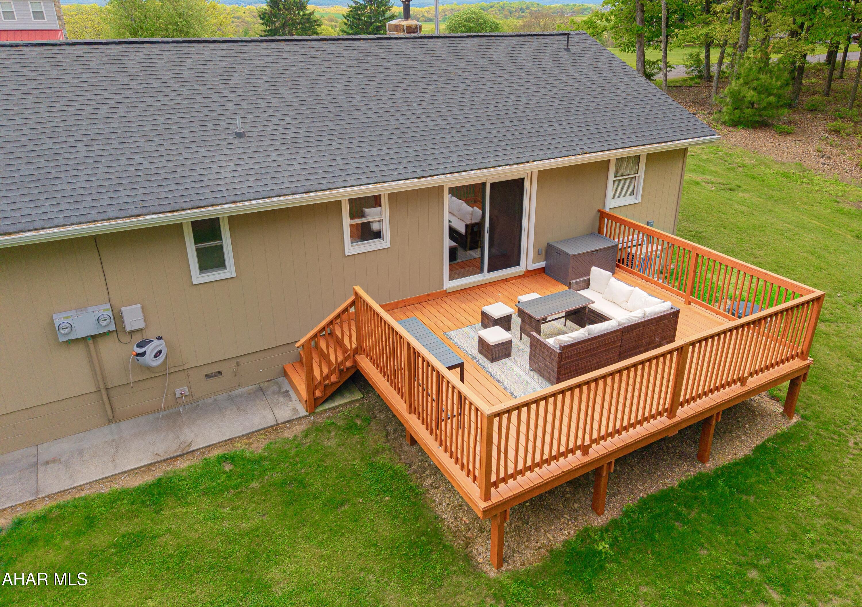 473 Calhoun Road Everett, PA 15537 - Photo 37 of 45 a view of a house with a yard and deck