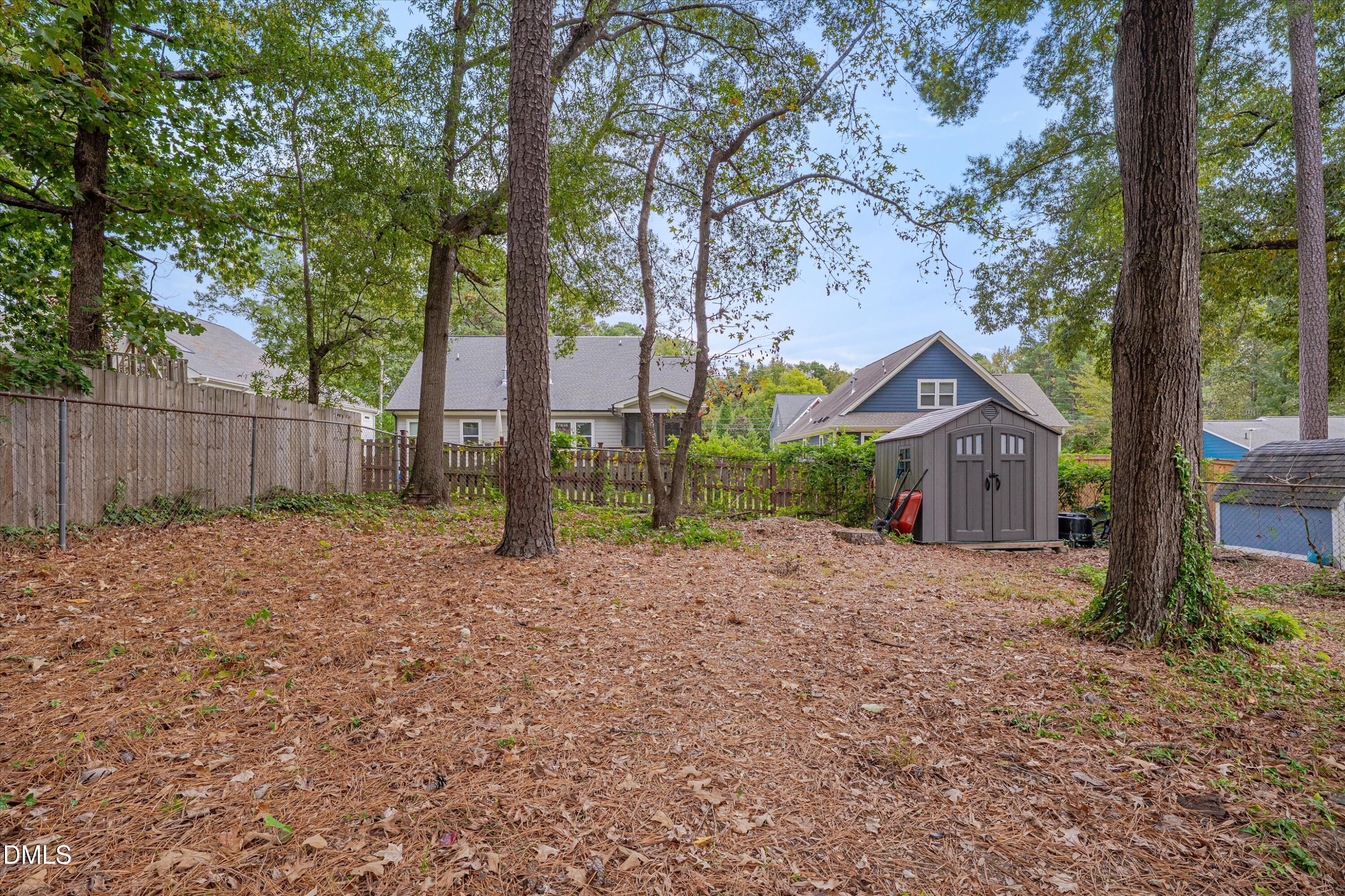 3301 Lassiter Street Durham, NC 27707 - Photo 27 of 32 a view of a house with backyard and tree