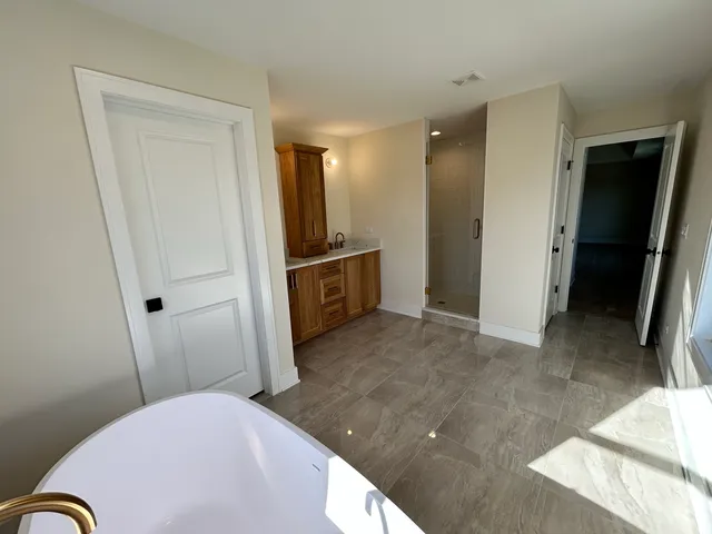 a bedroom with a bed and a sink