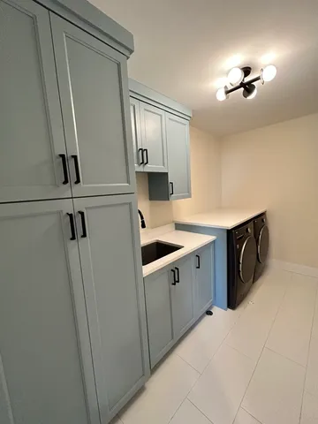 a kitchen with stainless steel appliances a sink stove and refrigerator