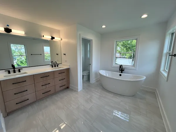 a view of room with window and mirror