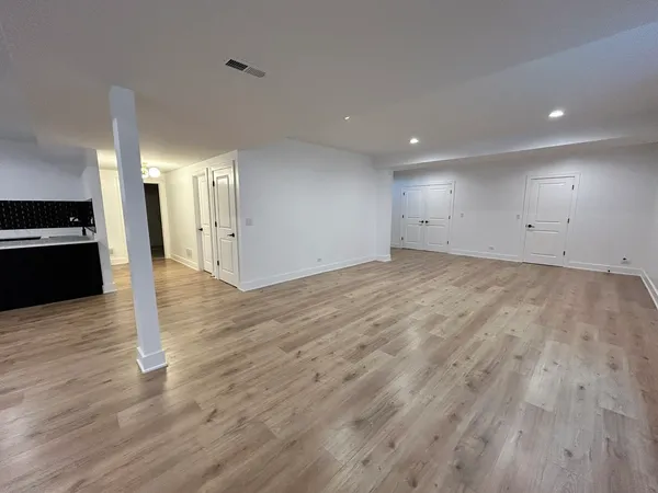 a view of a kitchen with wooden floor