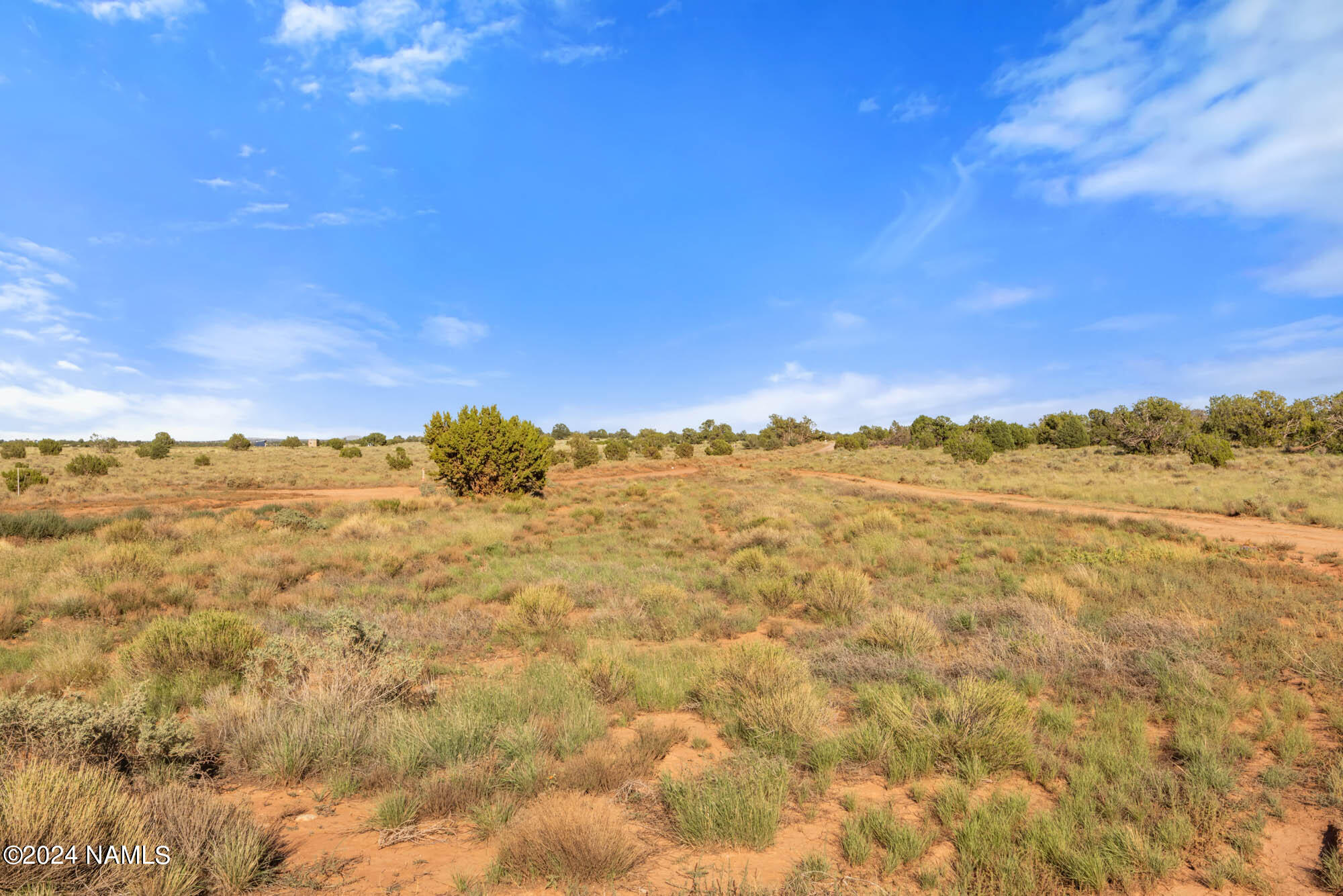 749 North Northland Road, Unit C Williams, AZ 86046 - Photo 8 of 14 a view of a large building with mountains in the background