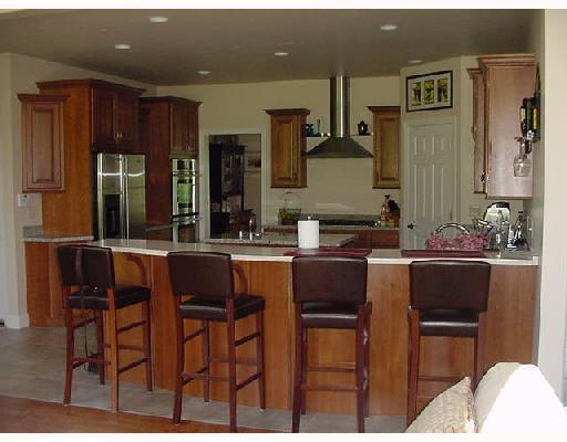 555 Chartiers Run Road Canonsburg, PA 15317 - Photo 2 of 8 Kitchen. Gourmet Kitchen has a center island w/sink, granite countertops and all stainless appliances! Neutral ceramic flooring, large pantry, double ovens and beautiful maple cabinetry.....Open to family room....GREAT FOR ENTERTAINING!
