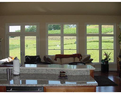 555 Chartiers Run Road Canonsburg, PA 15317 - Photo 5 of 8 View. View from kitchen into the living room and thru the wall of windows you can see some of the level back yard! Bar area in the kitchen can seat 4 people.