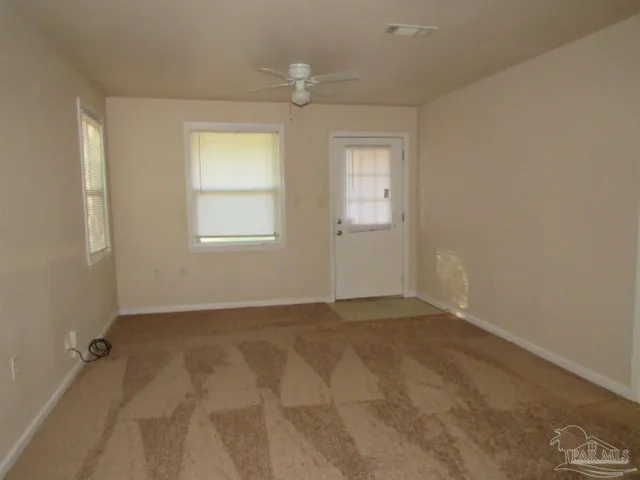 a view of an empty room with a window