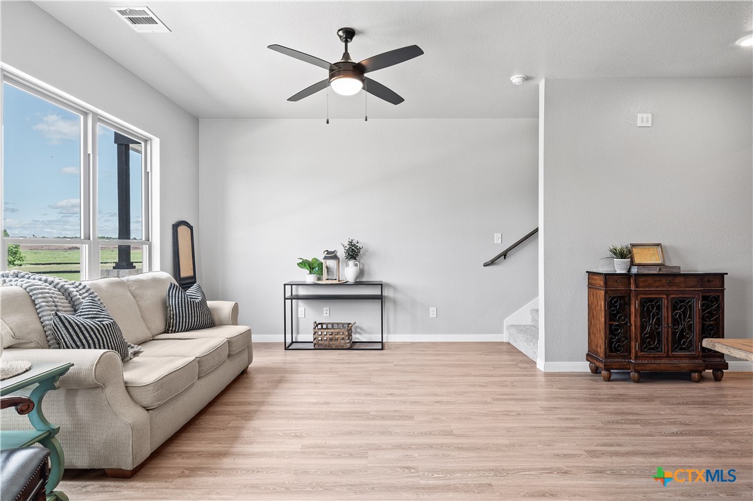 721 Meiomi Drive Temple, TX 76502 - Photo 6 of 19 a living room with furniture and a wooden floor