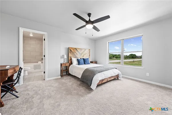 a bed room with a bed and a window