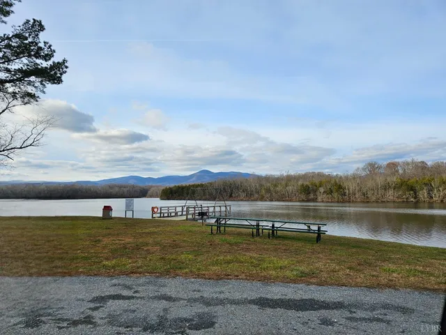 a view of a lake with houses in the back
