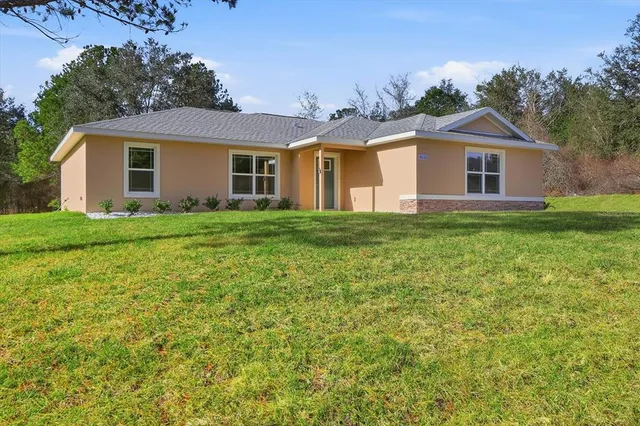 a front of a house with a garden