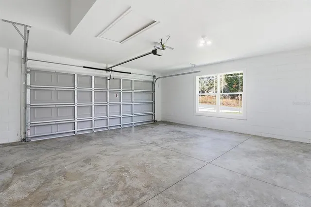 an empty room with a empty space and windows