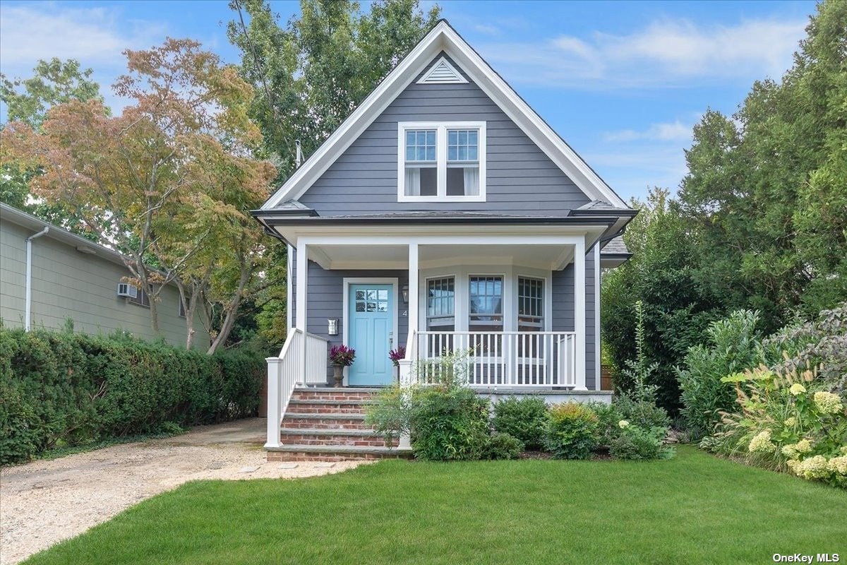49 Riggs Place Locust Valley, NY 11560 - Photo 1 of 1 a front view of a house with a yard