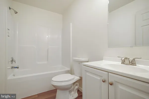 a bathroom with a sink toilet and bathtub