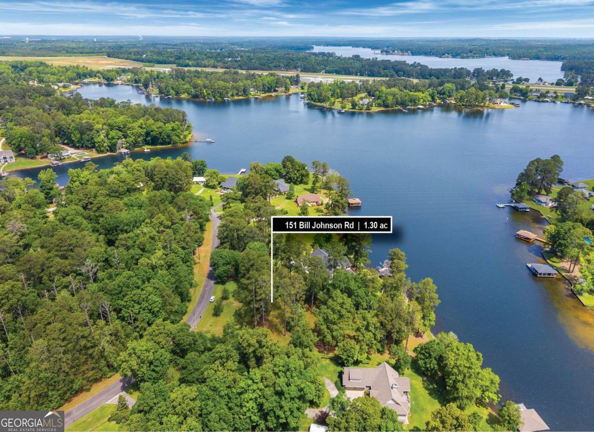 151 Bill Johnson Road Northeast Milledgeville, GA 31061 - Photo 14 of 27 an aerial view of residential houses with outdoor space and lake view