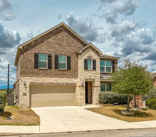 a front view of a house with yard