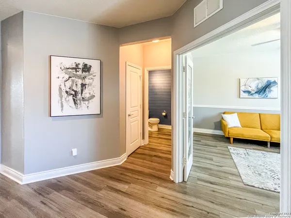 a view of a bedroom with furniture and a rug