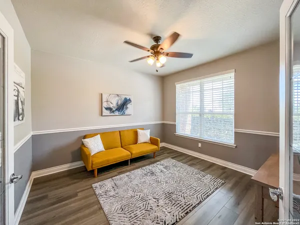 a living room with furniture and a rug