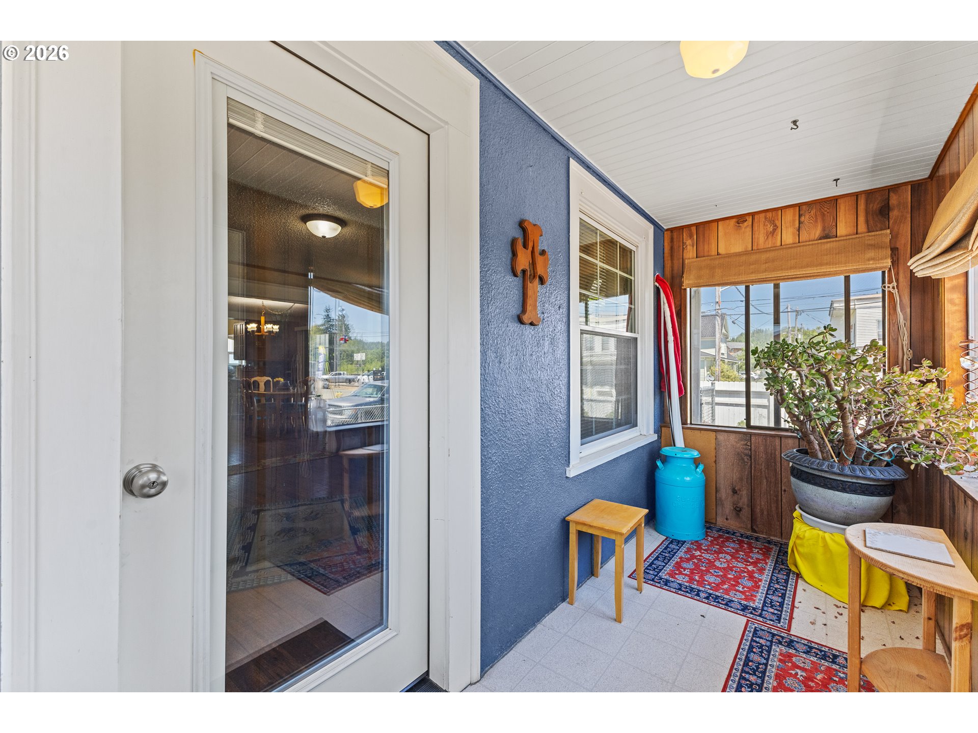 208 7th Street Myrtle Point, OR 97458 - Photo 14 of 48 a balcony with furniture and a potted plant