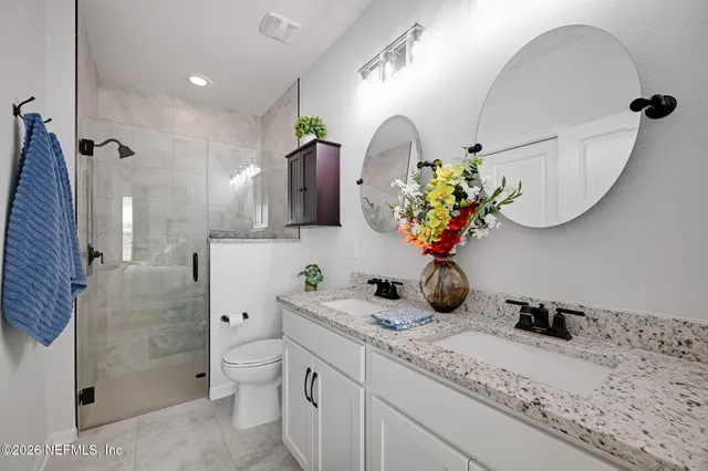 a view of a livingroom with workspace and a couch