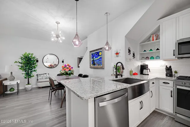 a kitchen that has a lot of cabinets