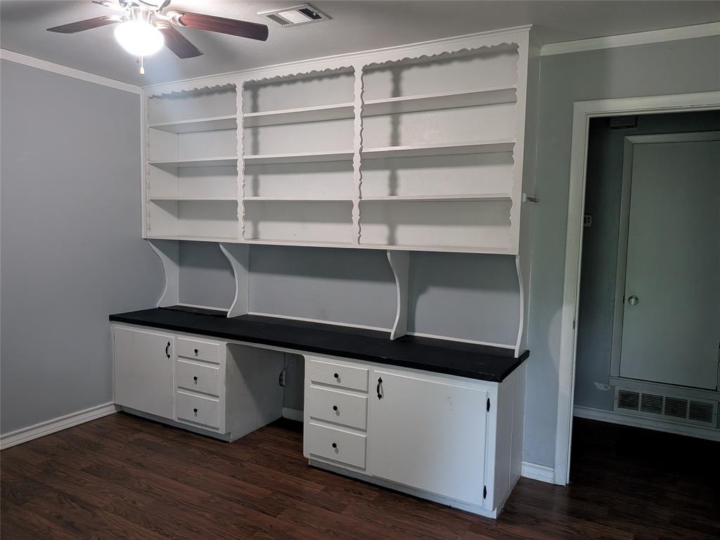2009 County Road 4619 Athens, TX 75752 - Photo 15 of 36 Unfurnished office featuring ornamental molding, dark wood-style flooring, a ceiling fan, and built in study area