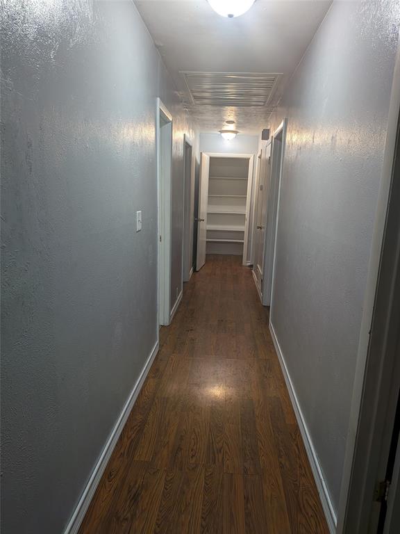 2009 County Road 4619 Athens, TX 75752 - Photo 19 of 36 Hall featuring dark wood-style flooring and baseboards