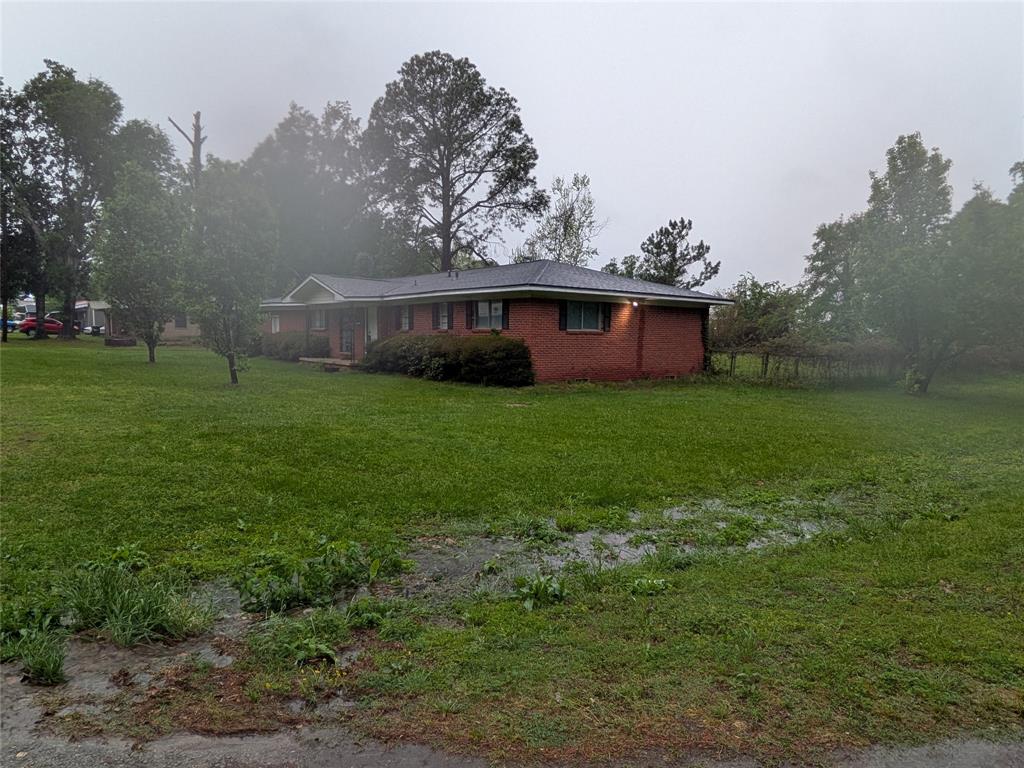 2009 County Road 4619 Athens, TX 75752 - Photo 2 of 36 a view of a house with a yard